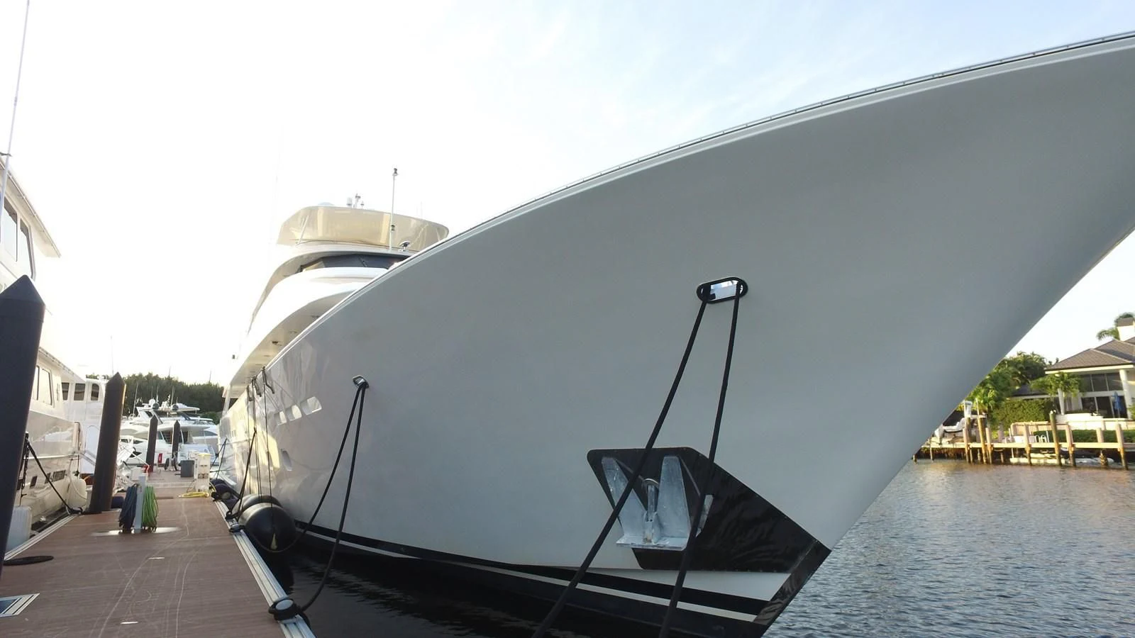a boat docked at a pier aboard ELYSIAN Yacht for Sale