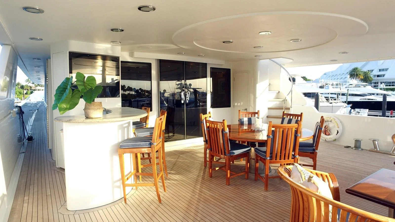 a room with tables and chairs aboard ELYSIAN Yacht for Sale