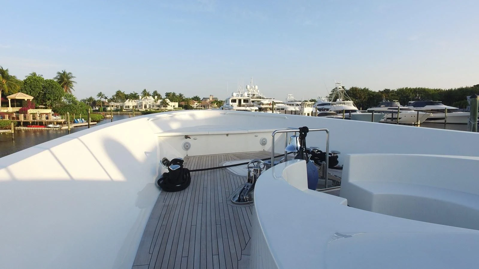 a deck with a large ship in the background aboard ELYSIAN Yacht for Sale