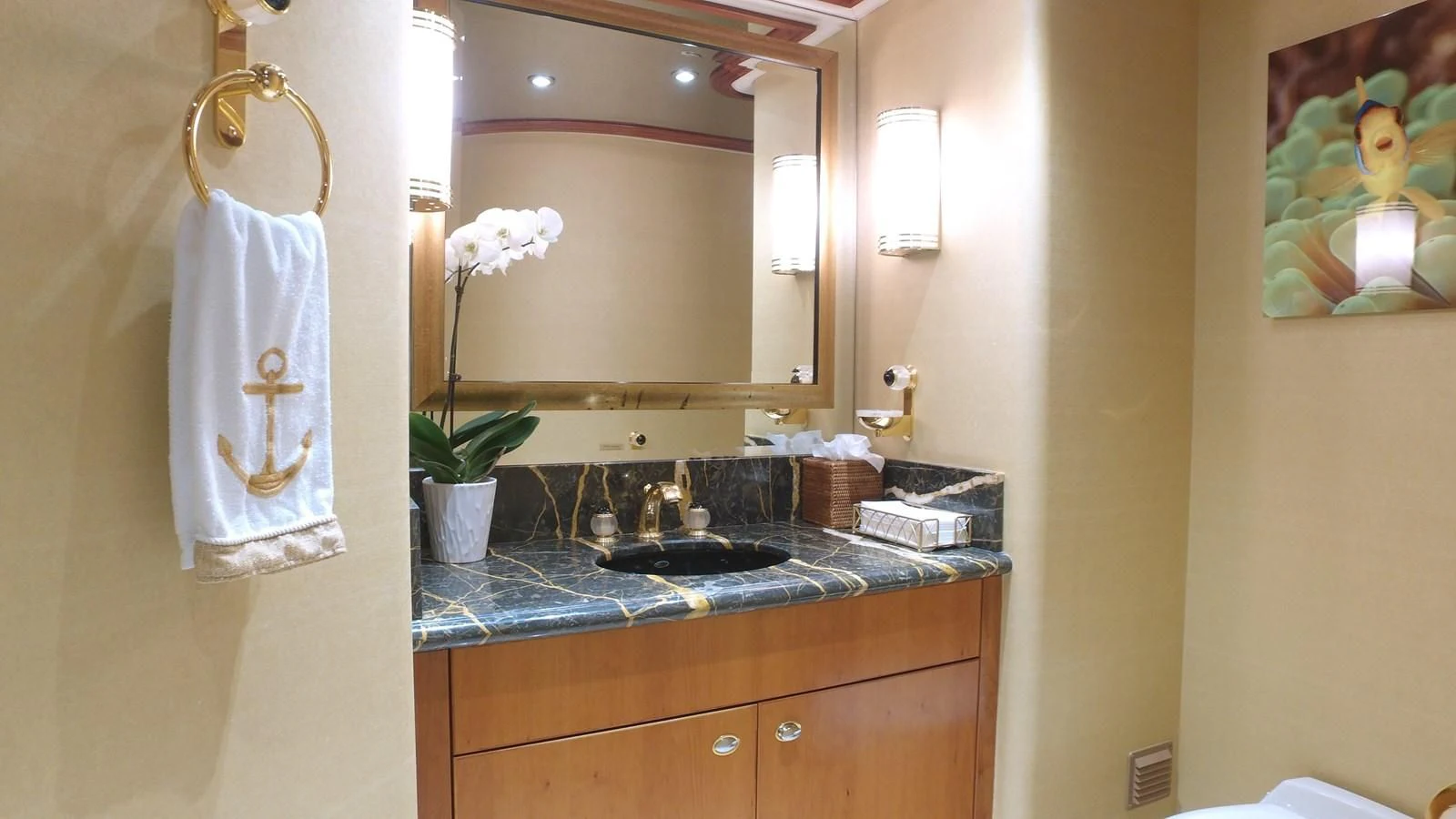 a bathroom with a sink and a mirror aboard ELYSIAN Yacht for Sale