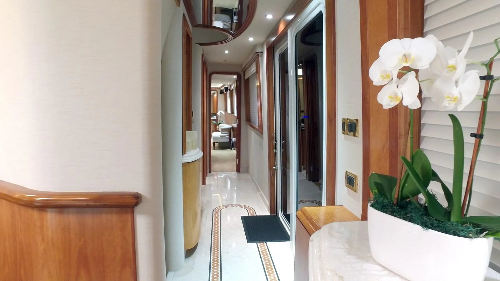 a hallway with flowers aboard ELYSIAN Yacht for Sale