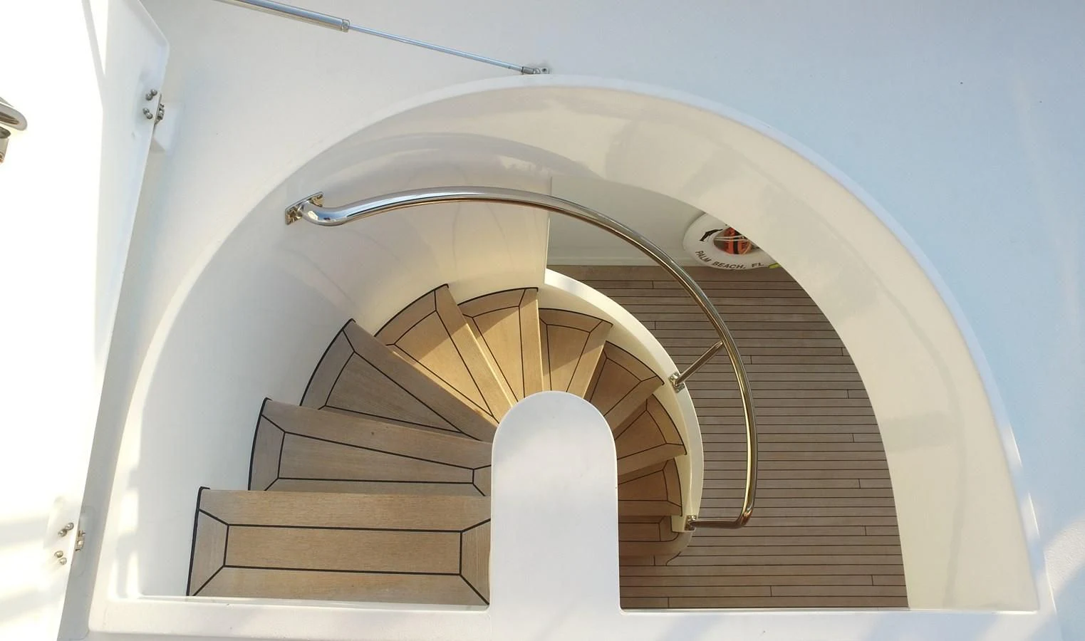 a white spiral staircase aboard ELYSIAN Yacht for Sale