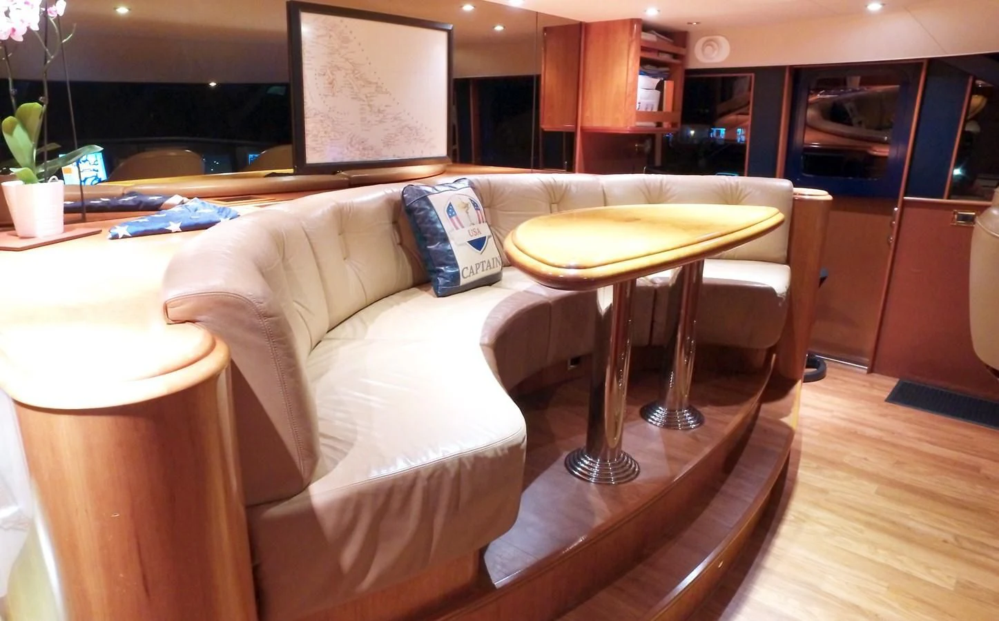 a couch and a table in a room aboard ELYSIAN Yacht for Sale