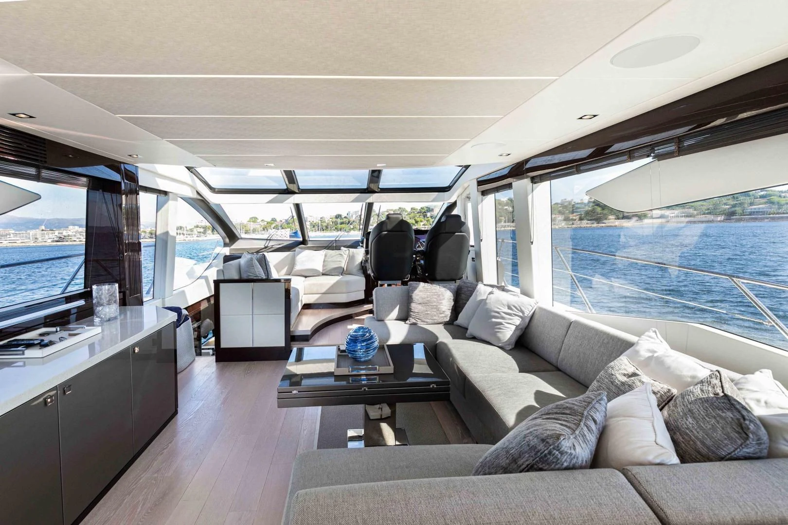 a large living room with a large window aboard H Yacht for Sale