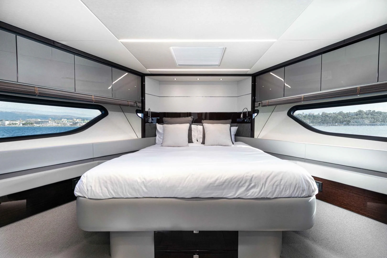 a room with a bed and a window aboard H Yacht for Sale
