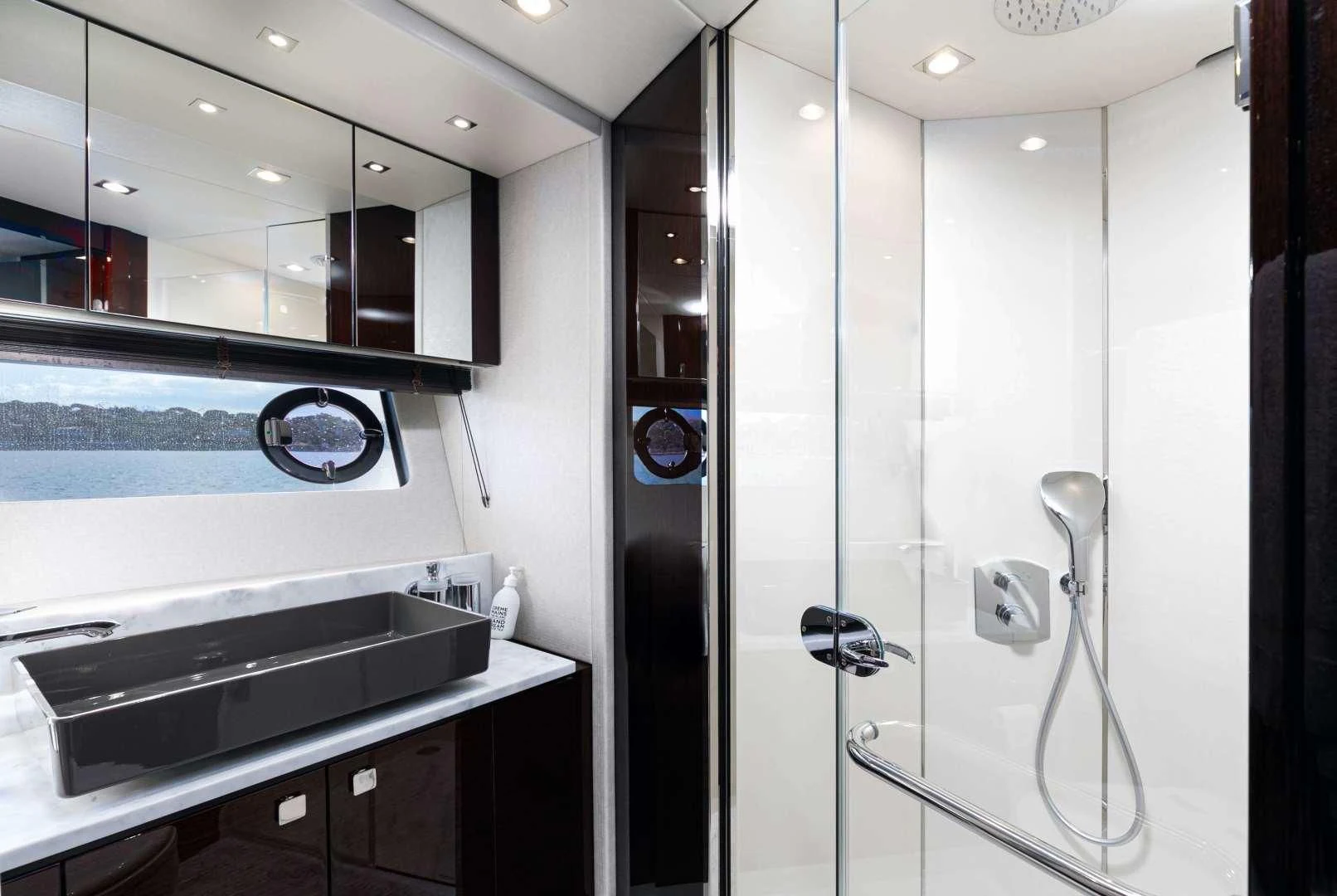 a bathroom with a shower unit aboard H Yacht for Sale