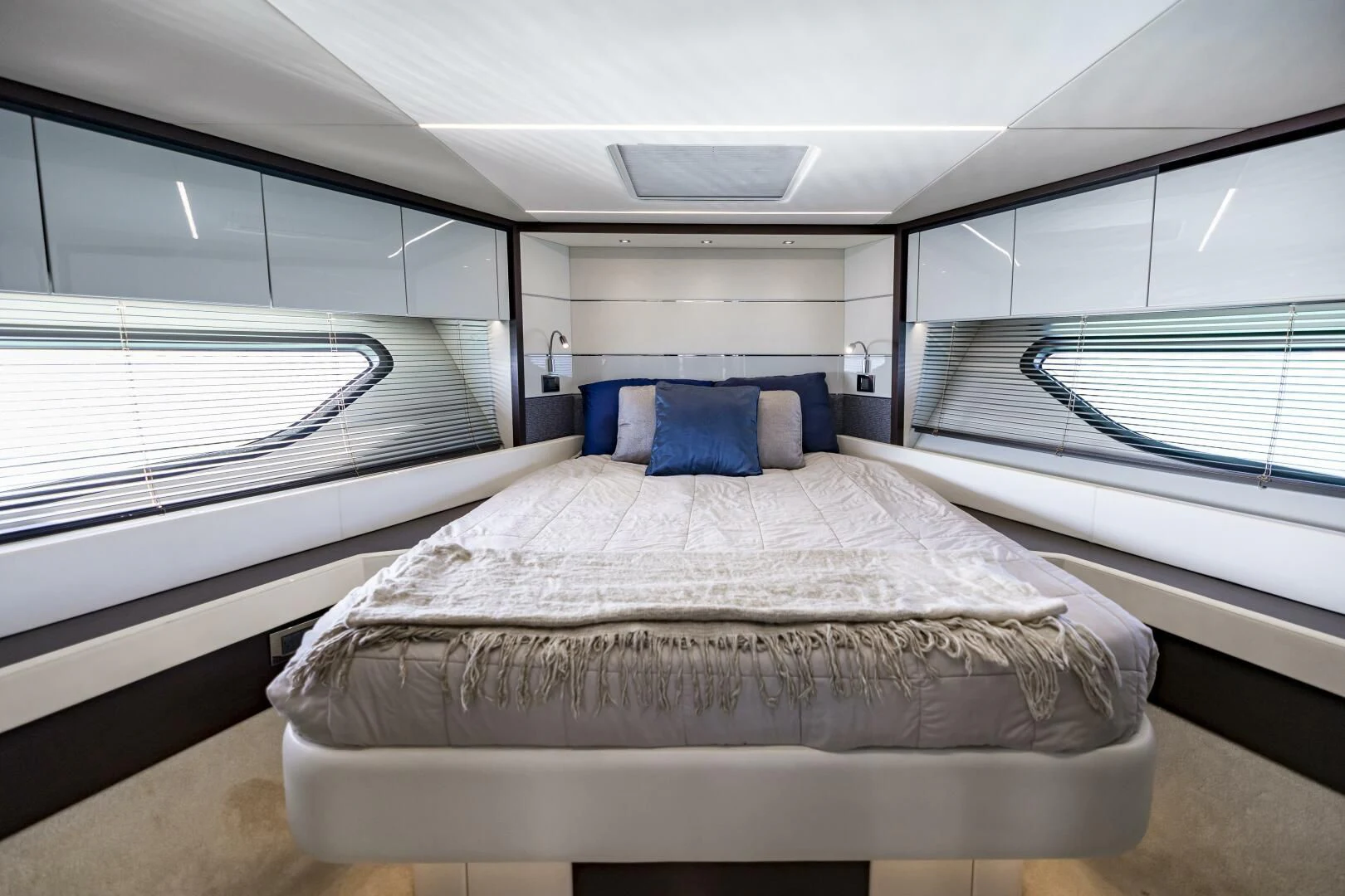 a room with a bed and a window aboard H Yacht for Sale