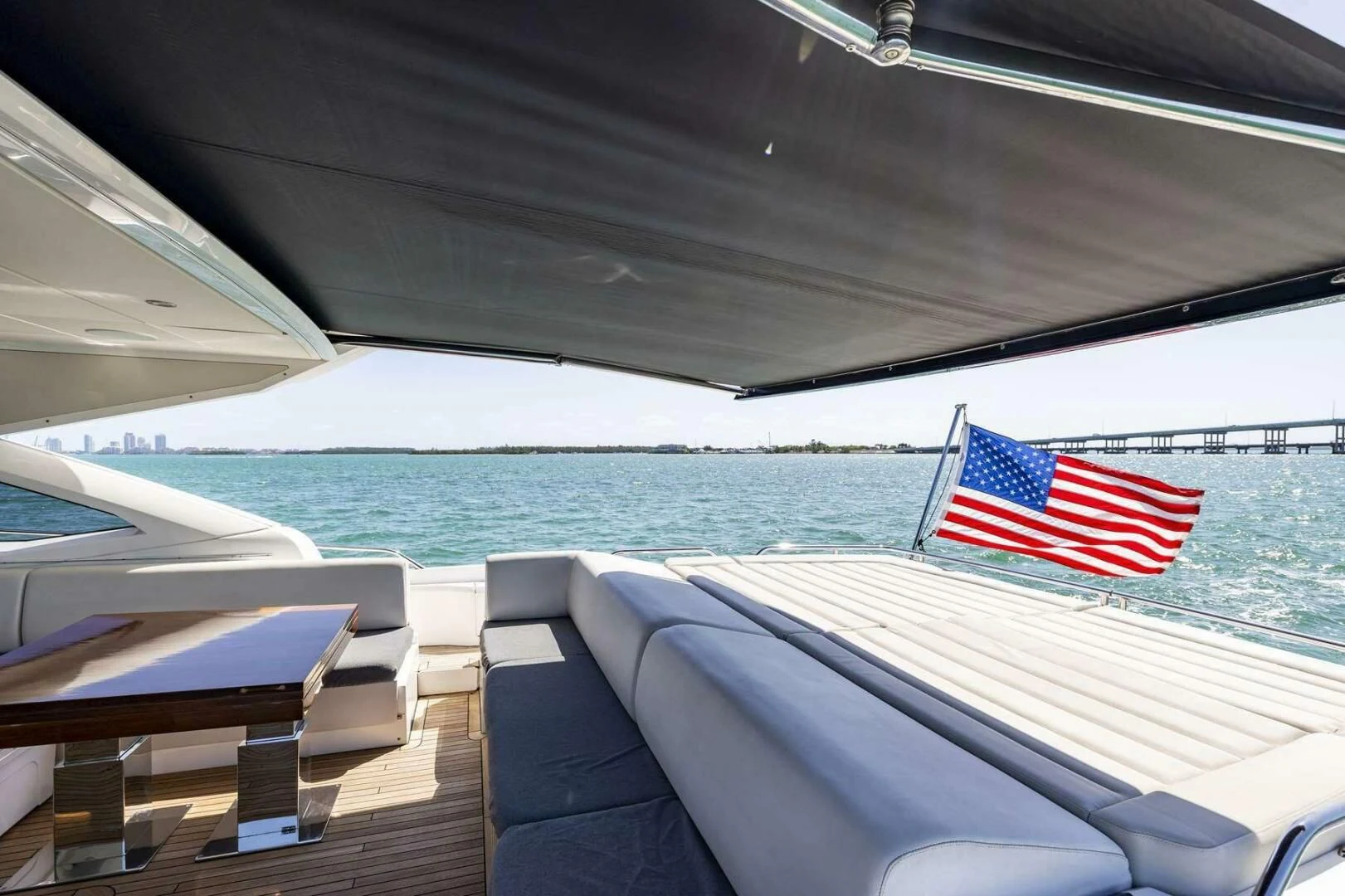 a boat with a flag on it aboard H Yacht for Sale
