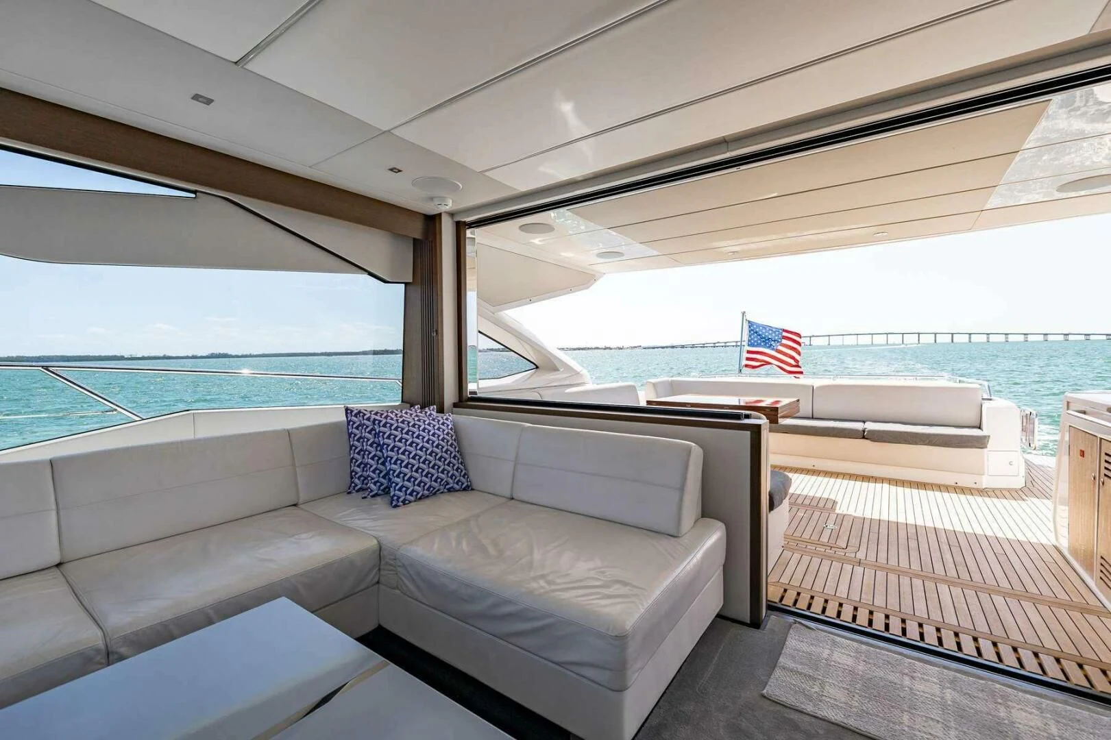 a couch and a table on a boat aboard H Yacht for Sale