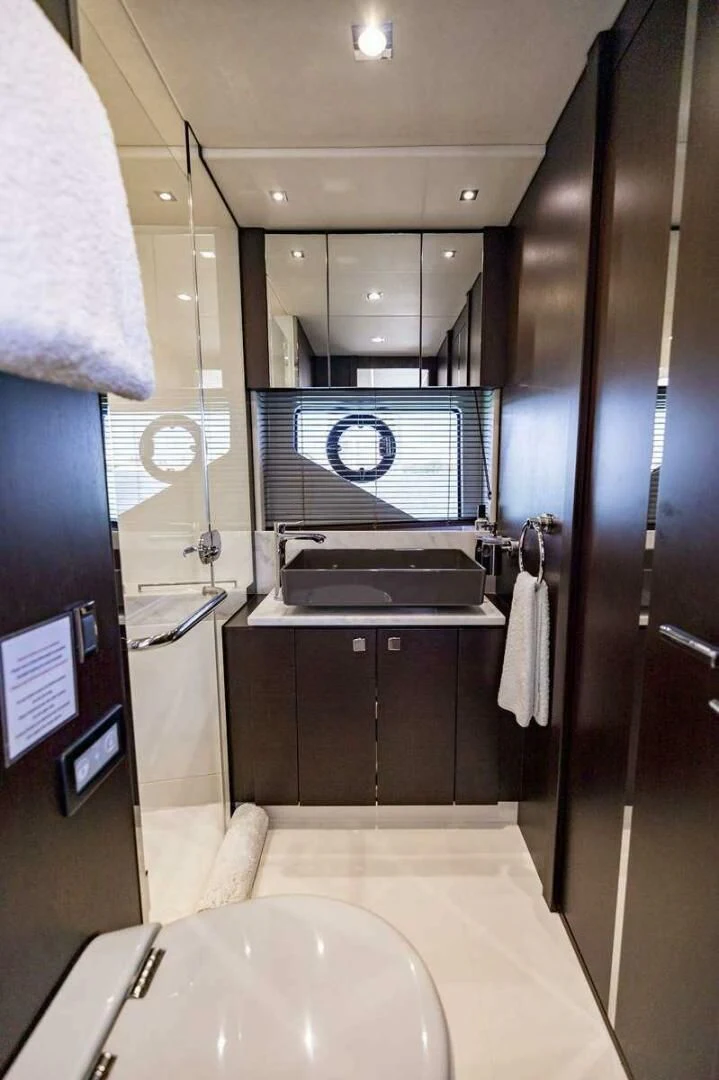 a bathroom with a sink and a toilet aboard H Yacht for Sale