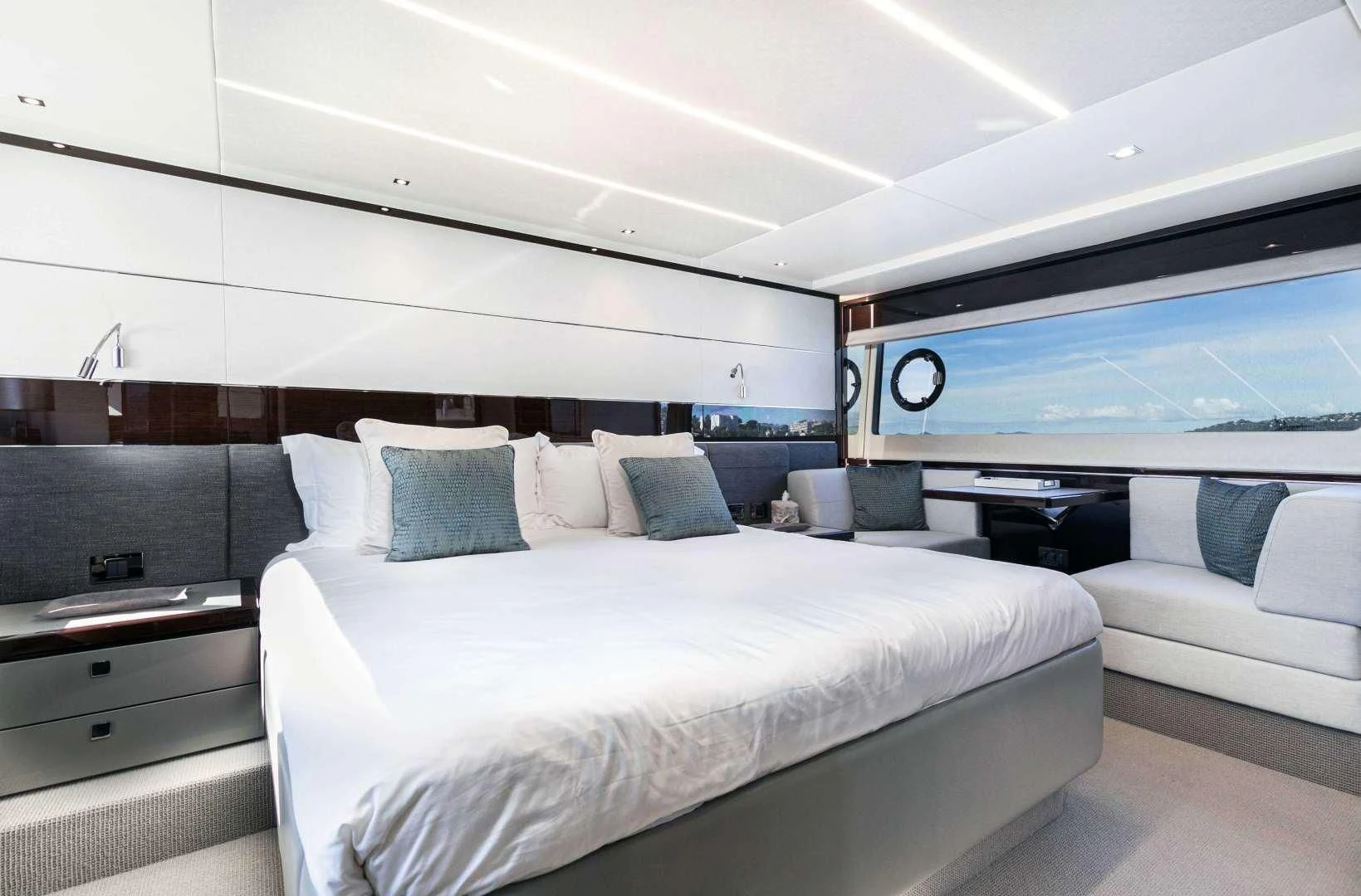 a room with a bed and a couch aboard H Yacht for Sale
