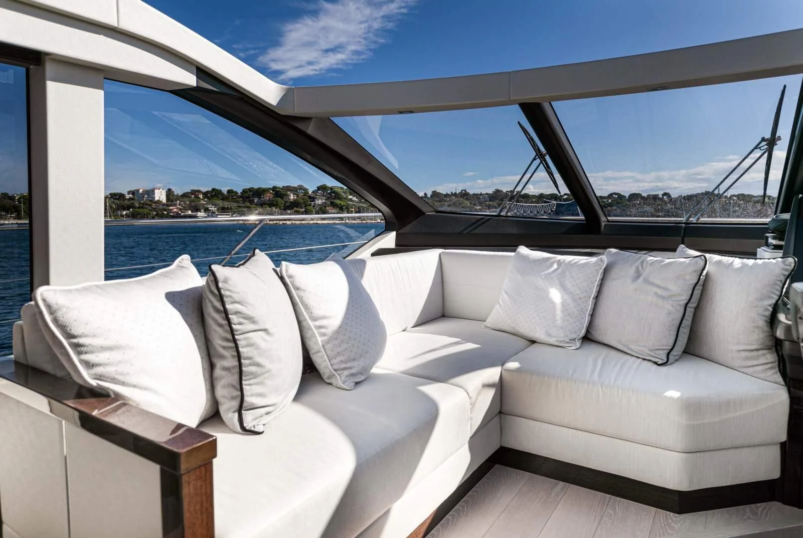 a white couch with pillows on it aboard H Yacht for Sale