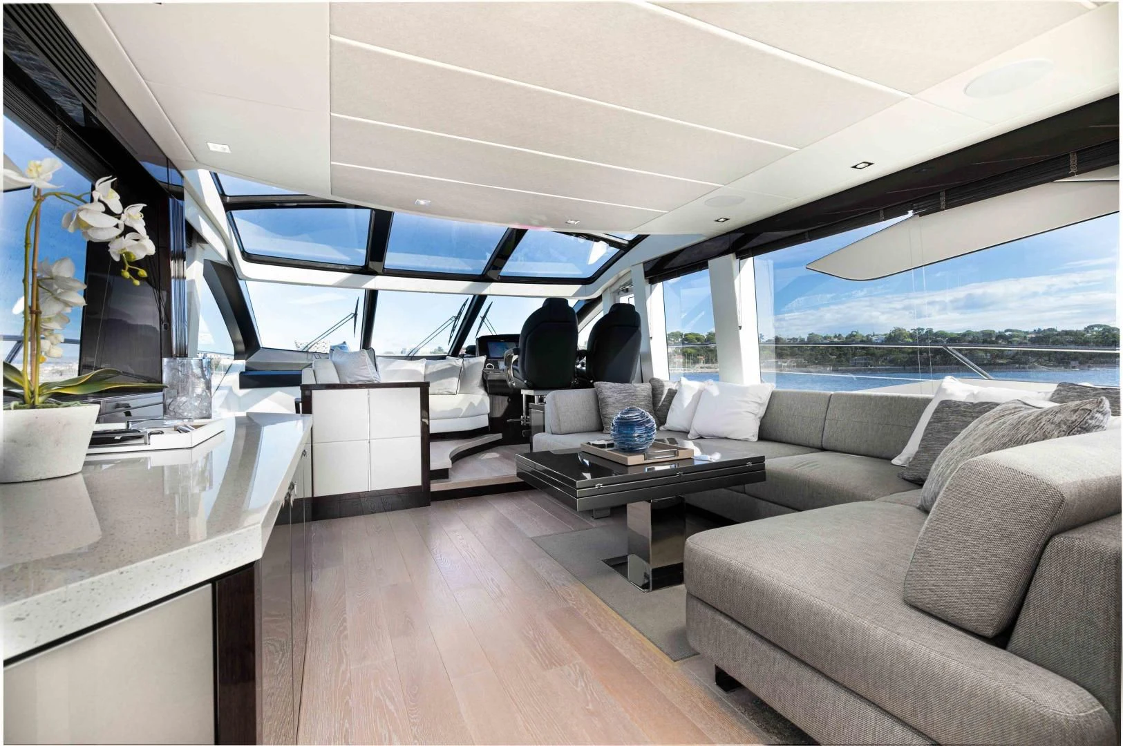 a living room with a large window aboard H Yacht for Sale