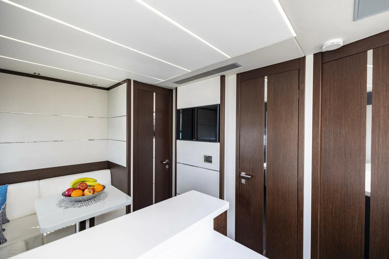 a room with a table and a microwave aboard H Yacht for Sale