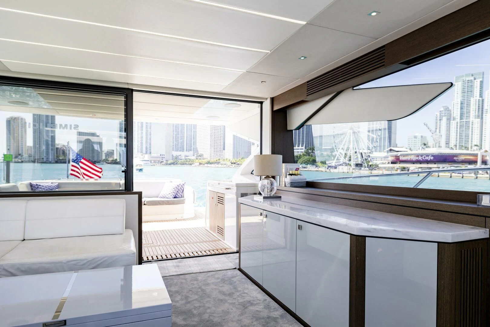 a room with a desk and a window with a flag aboard H Yacht for Sale