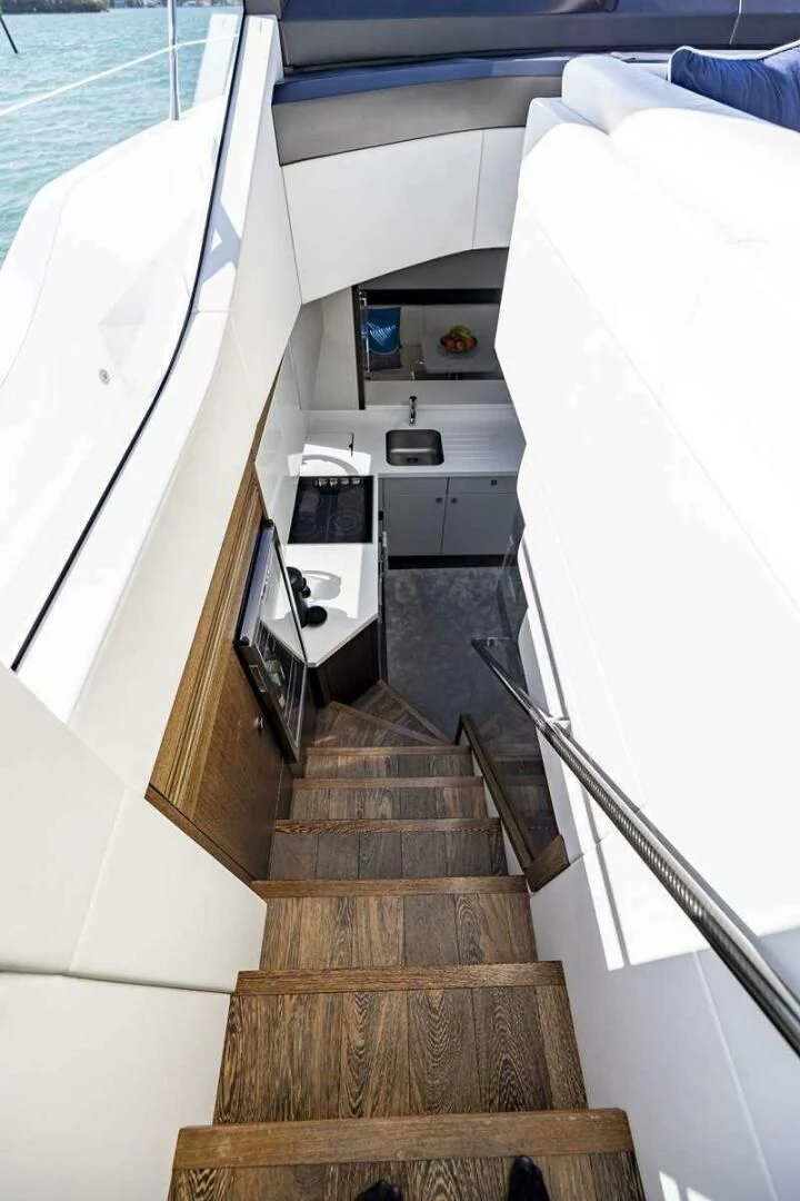 a staircase leading to a beach aboard H Yacht for Sale