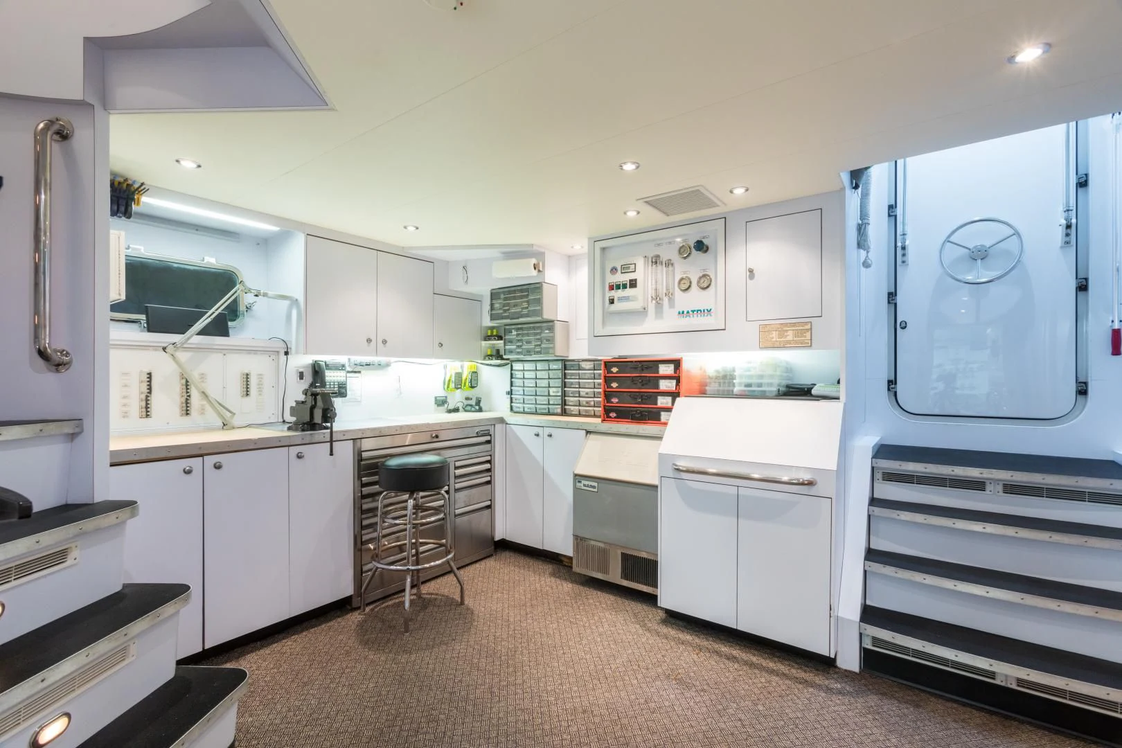 a kitchen with white cabinets aboard SHOGUN Yacht for Sale