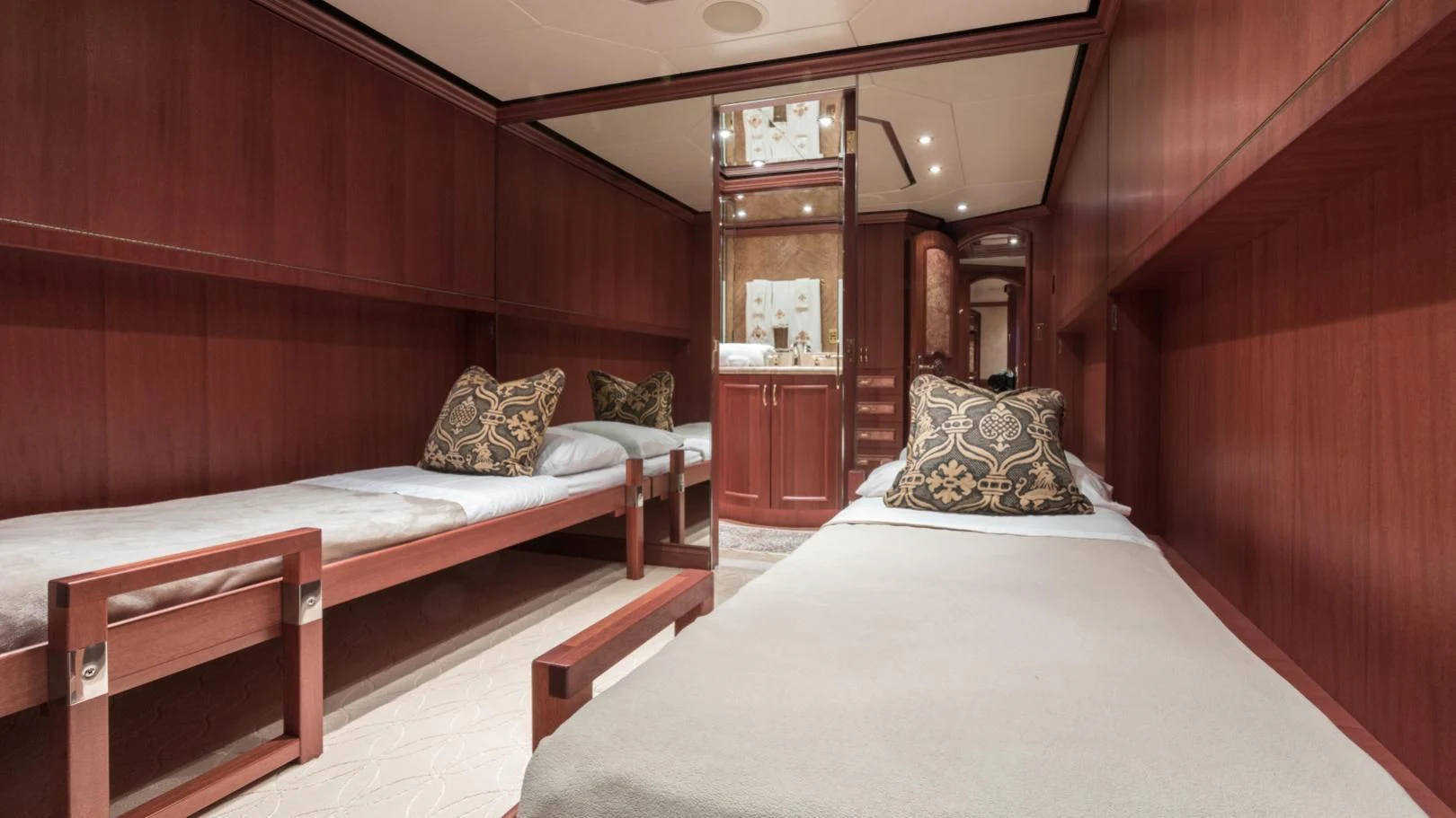 a room with a bed and a mirror aboard SHOGUN Yacht for Sale