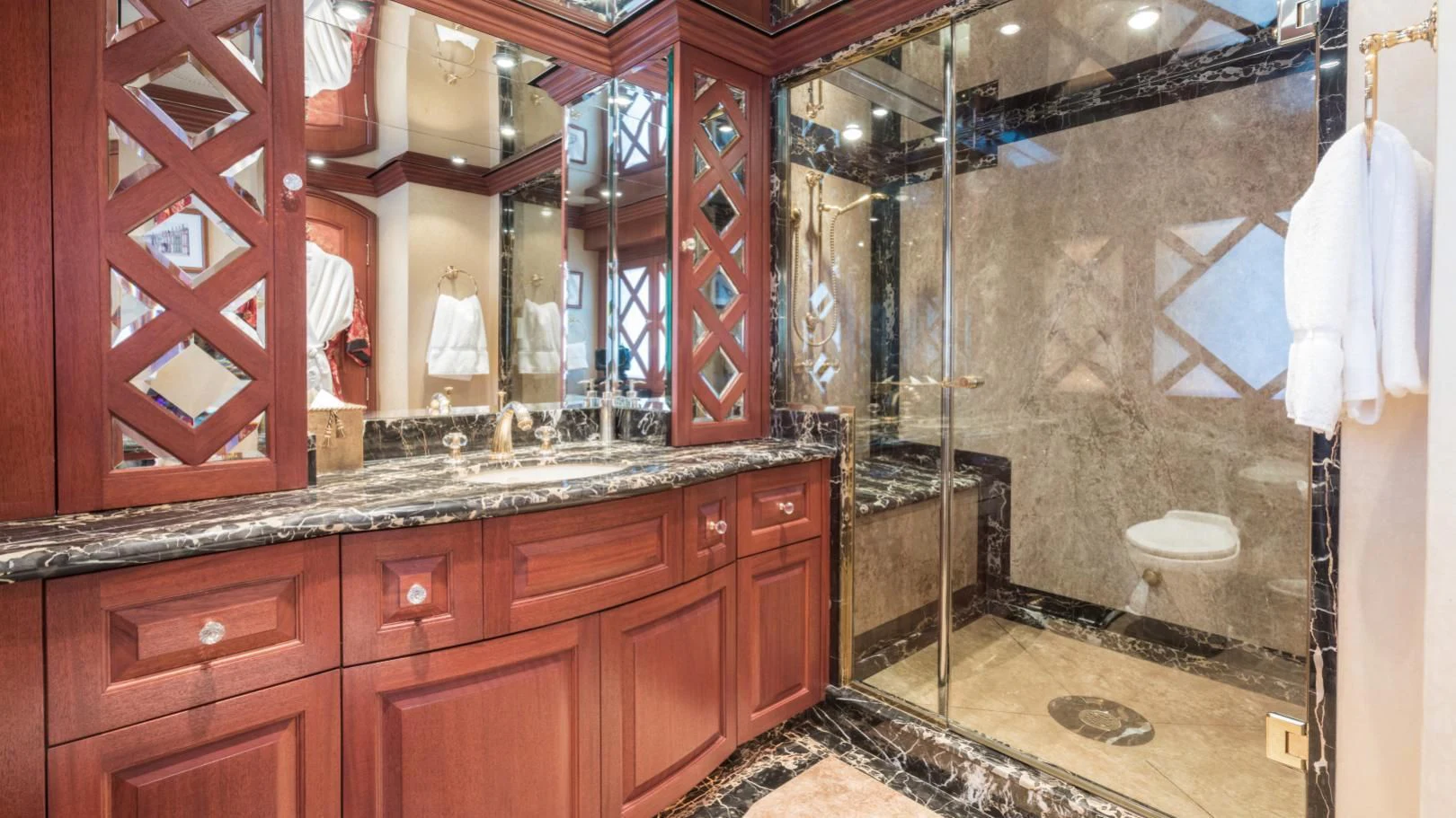 a bathroom with a large mirror aboard SHOGUN Yacht for Sale