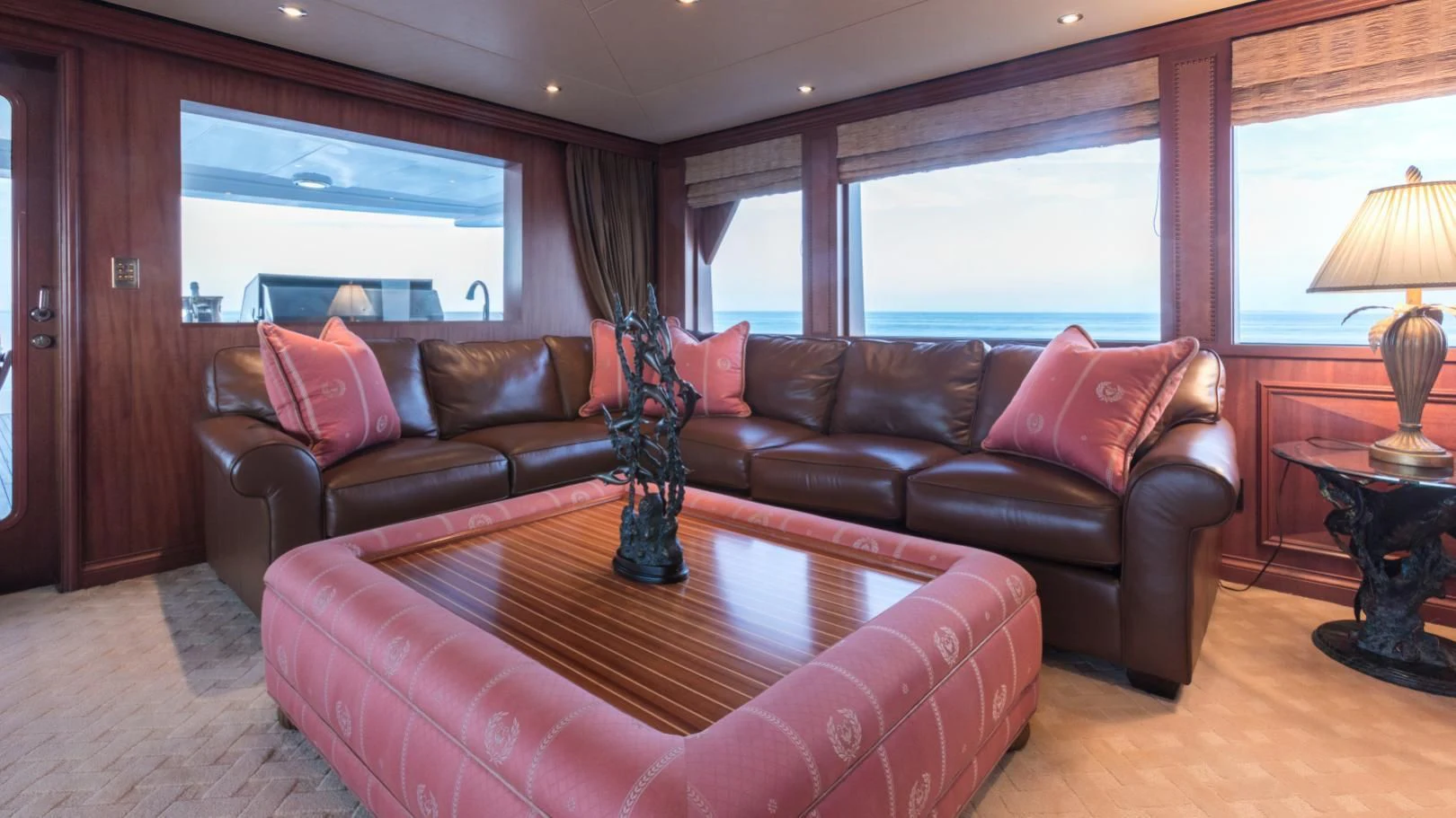 a living room with a leather couch aboard SHOGUN Yacht for Sale