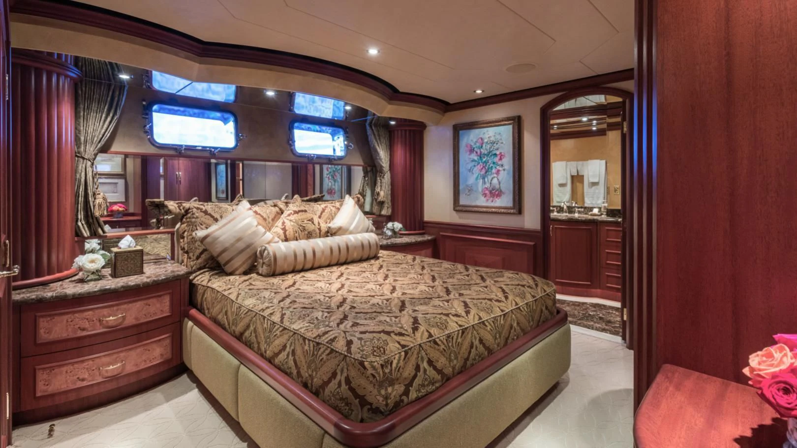 a bedroom with a bed and a dresser aboard SHOGUN Yacht for Sale