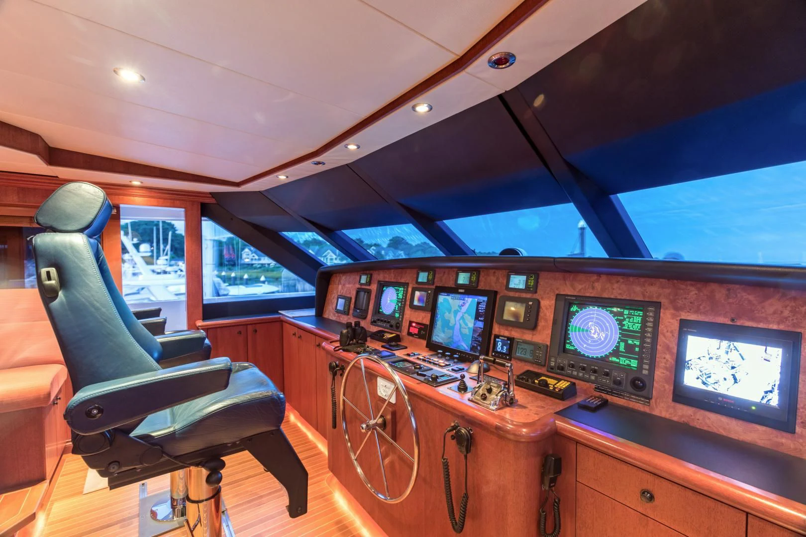 inside of a vehicle with a desk and chairs and monitors aboard SHOGUN Yacht for Sale