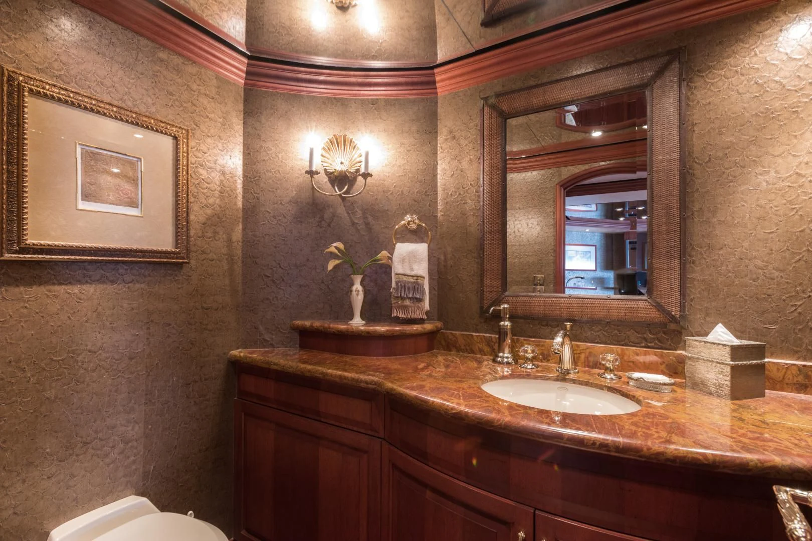 a bathroom with a sink and mirror aboard SHOGUN Yacht for Sale
