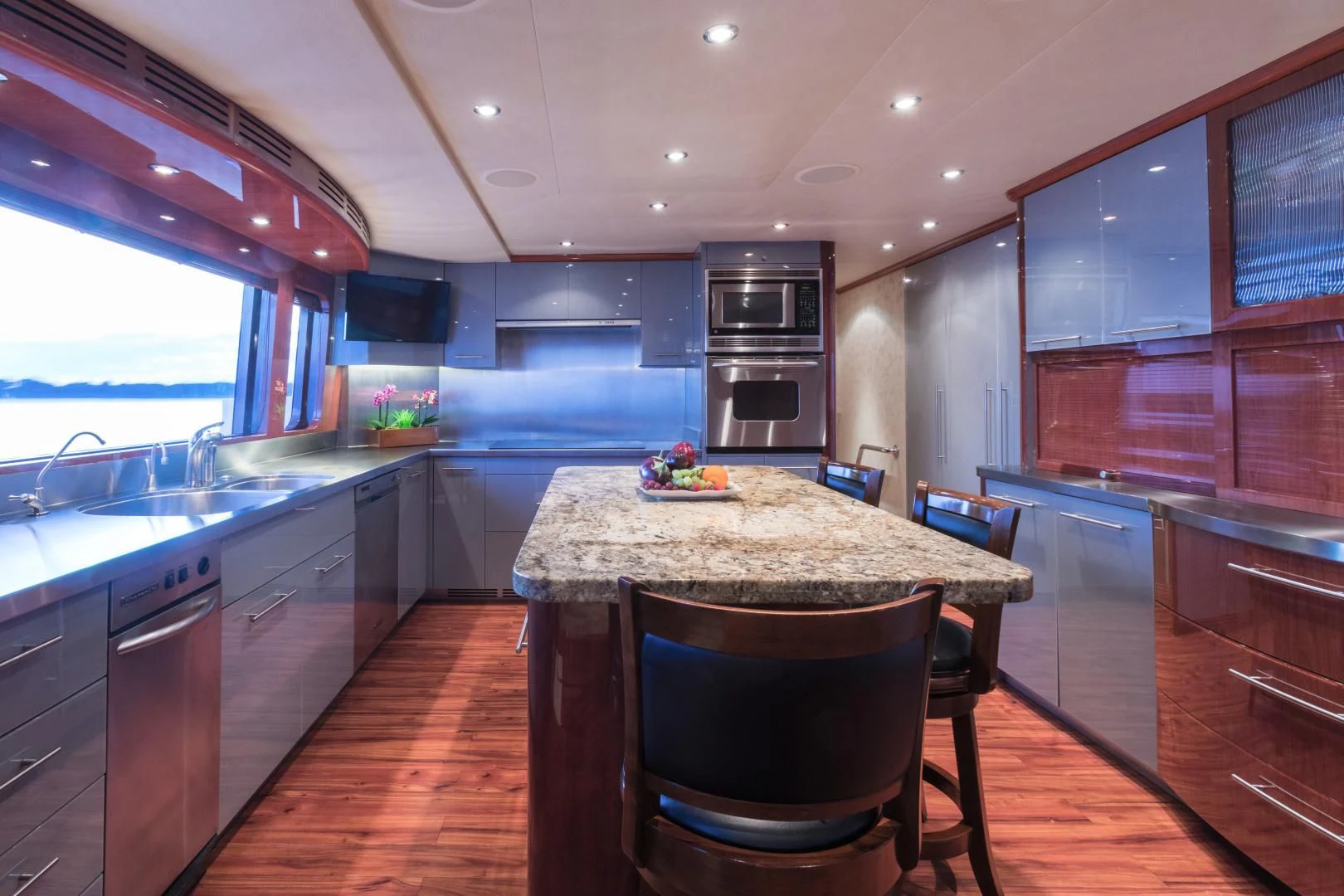a kitchen with a table and chairs aboard SHOGUN Yacht for Sale