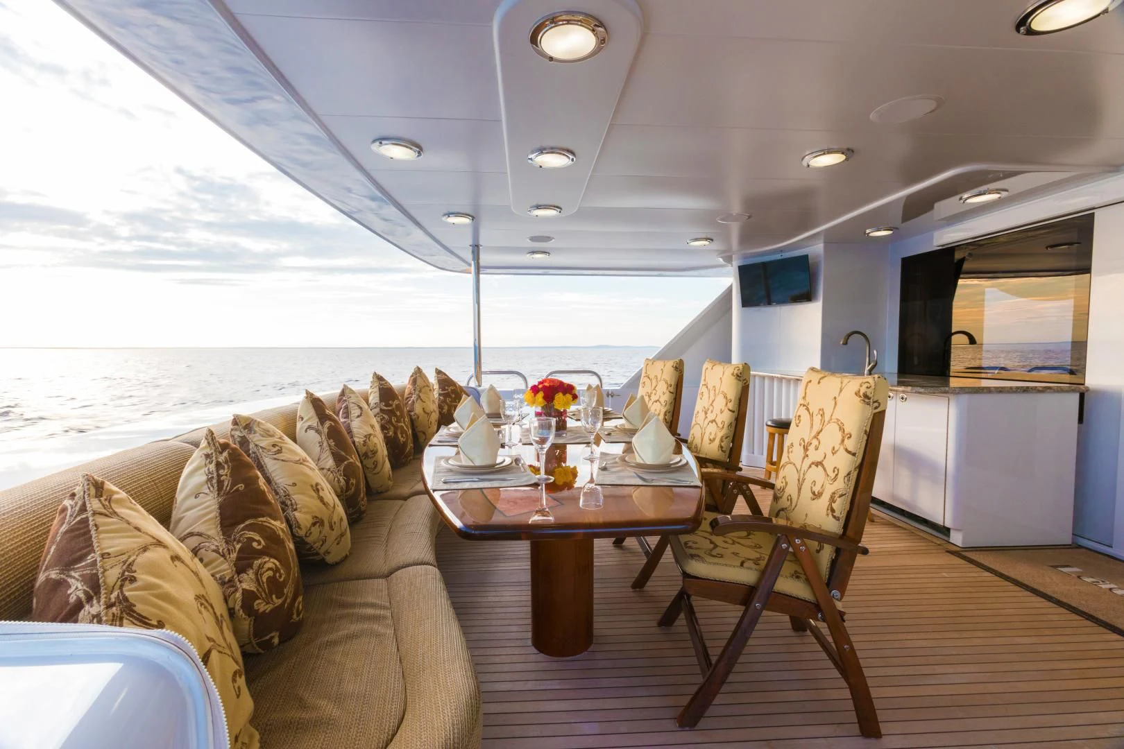 a living room with a couch and a table aboard SHOGUN Yacht for Sale