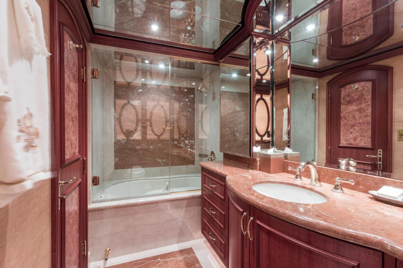 a bathroom with a sink and a shower aboard SHOGUN Yacht for Sale