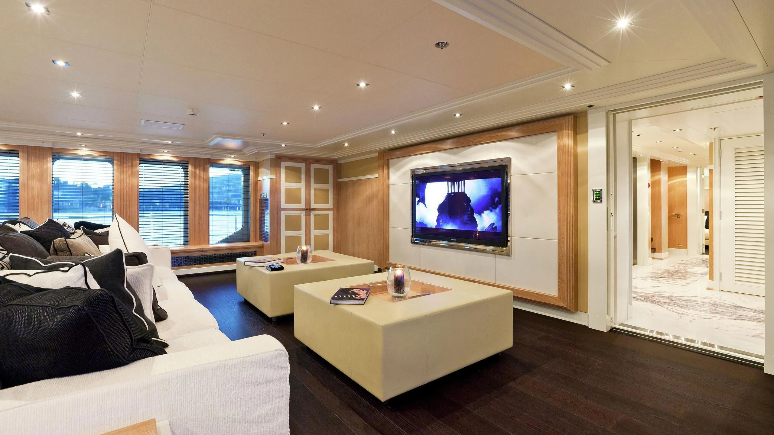 a living room with a large tv aboard BELLA 2 Yacht for Sale