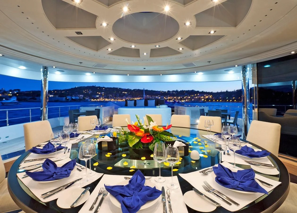 a table set with place settings aboard BELLA 2 Yacht for Sale