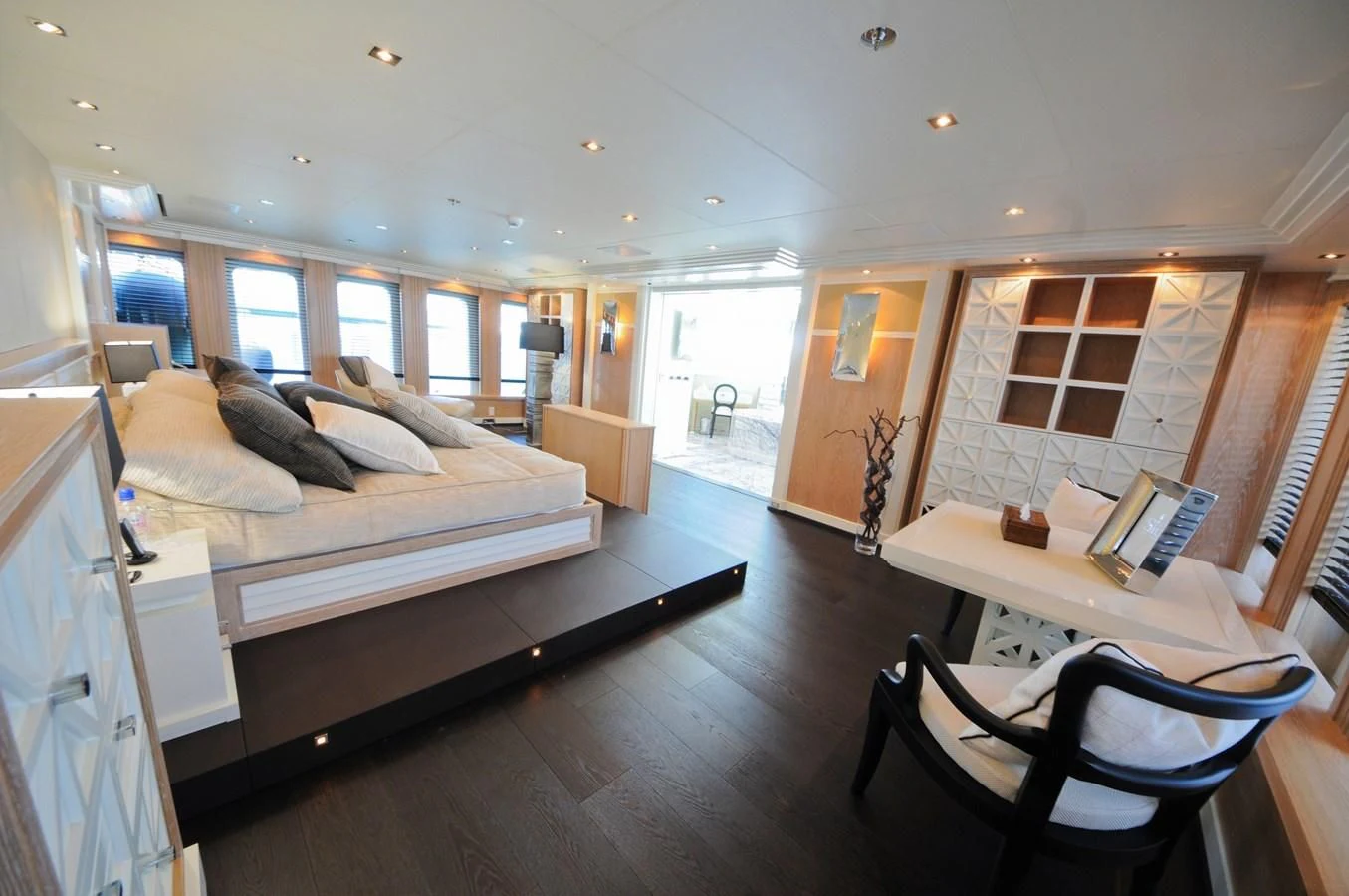 a bedroom with a bed and a desk aboard BELLA 2 Yacht for Sale