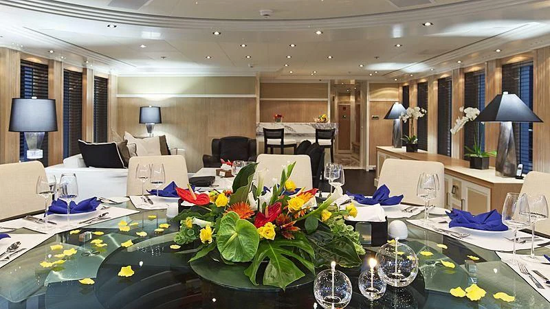 a large room with a table and chairs aboard BELLA 2 Yacht for Sale
