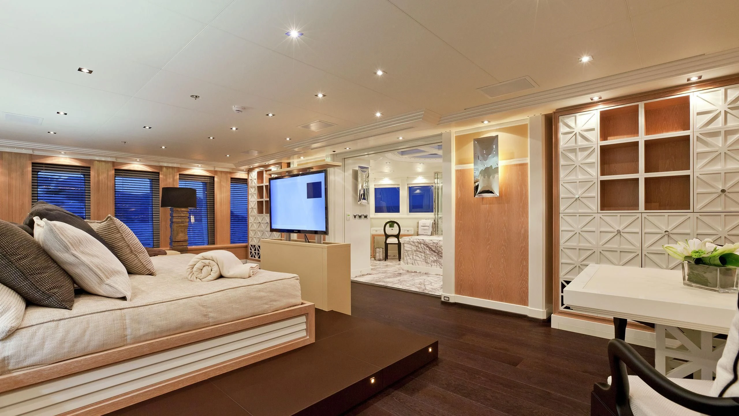 a bedroom with a bed and a tv aboard BELLA 2 Yacht for Sale