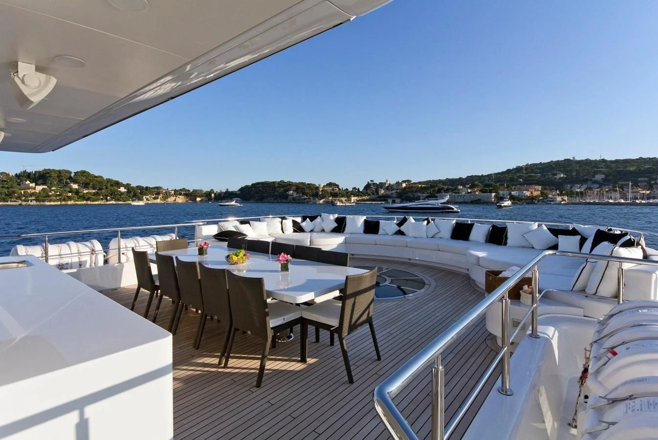 a deck with chairs and tables on it aboard BELLA 2 Yacht for Sale