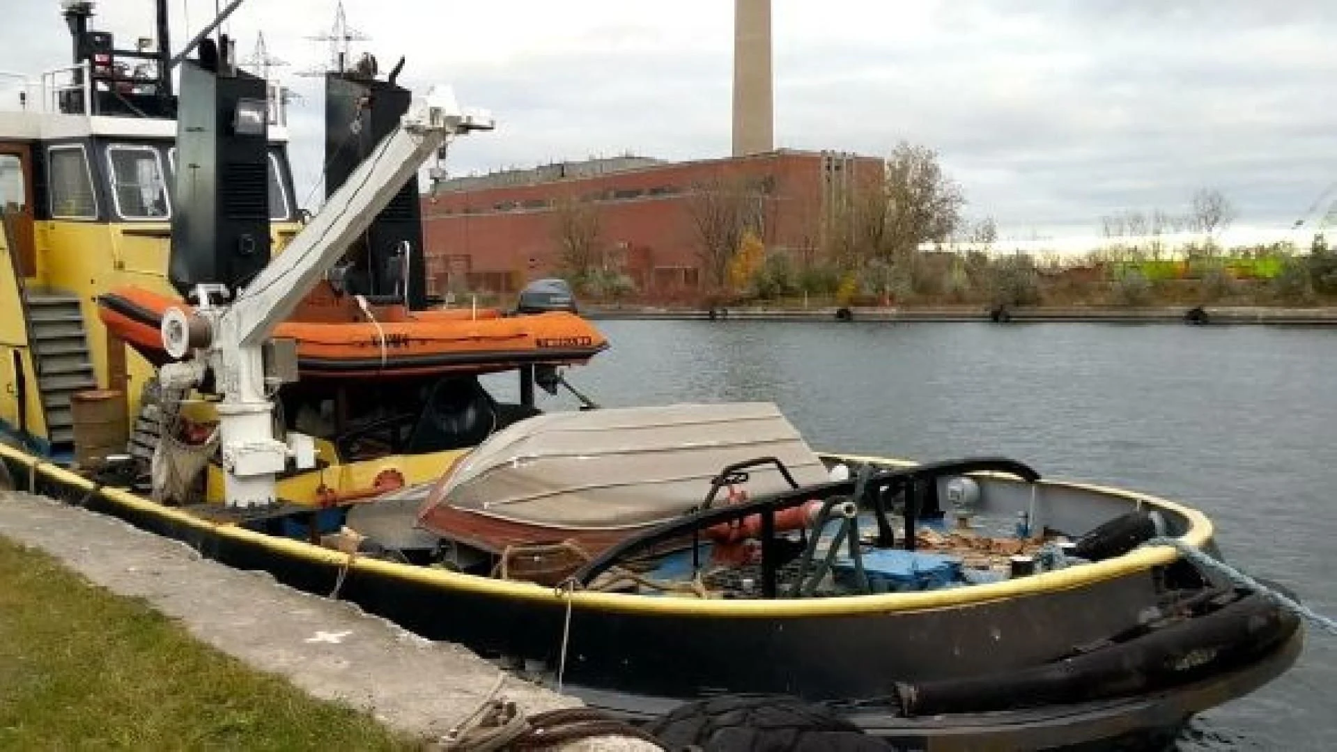 a large yellow machine on a barge aboard ITINERANTE I Yacht for Sale