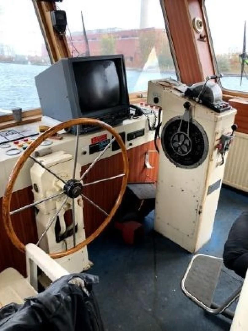 a boat with a tv and a computer on it aboard ITINERANTE I Yacht for Sale