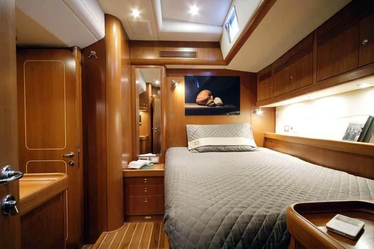 a bed in a cabin aboard DHARMA Yacht for Sale