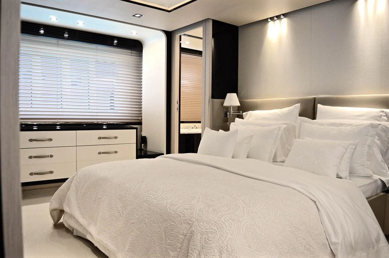 a large bed with white sheets aboard MEMORIES Yacht for Sale