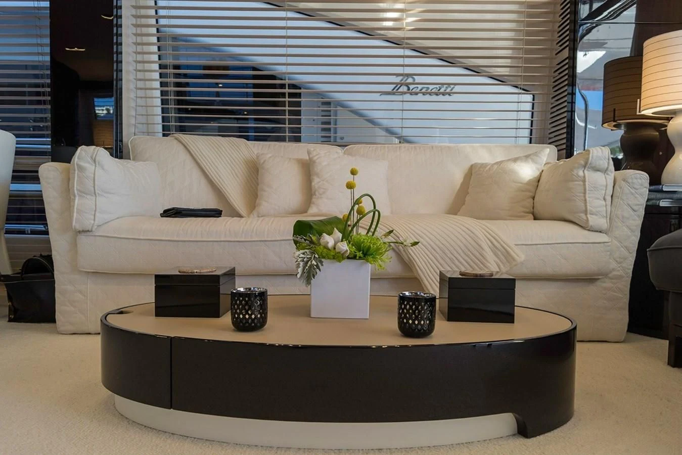 a white couch with a plant on it aboard MEMORIES Yacht for Sale