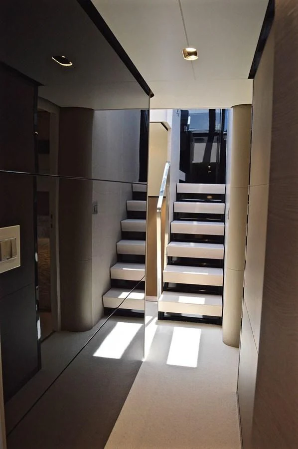 a hallway with a set of stairs aboard MEMORIES Yacht for Sale