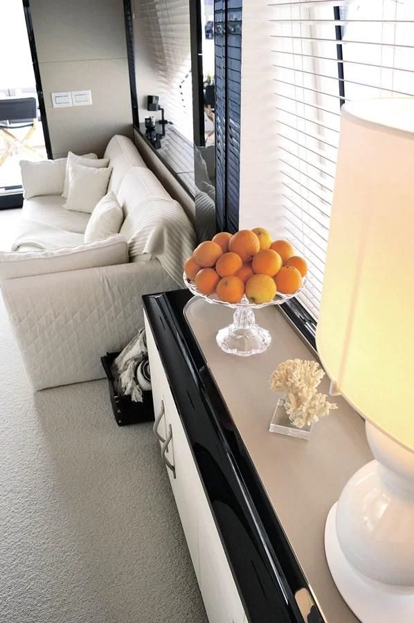 a bedroom with a bed and a table aboard MEMORIES Yacht for Sale
