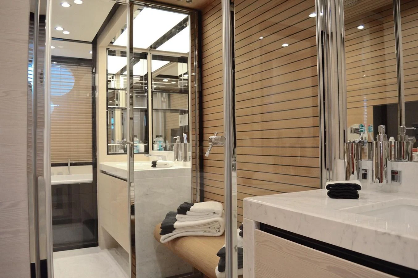 a bathroom with a large mirror aboard MEMORIES Yacht for Sale