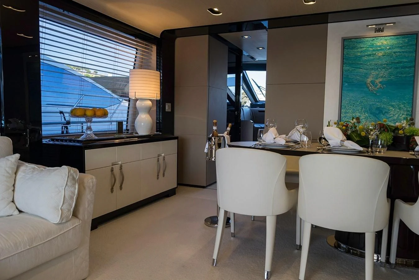 a room with a table and chairs aboard MEMORIES Yacht for Sale