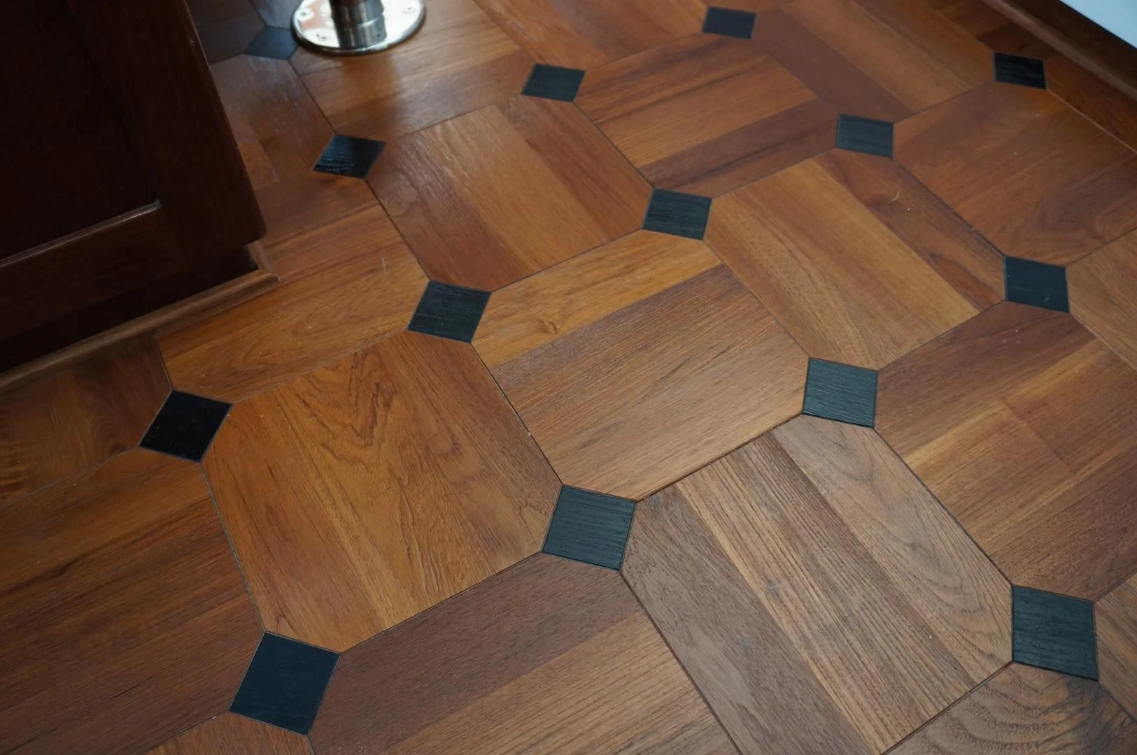 a wood floor with blue and black squares on it aboard LARIMAR Yacht for Sale