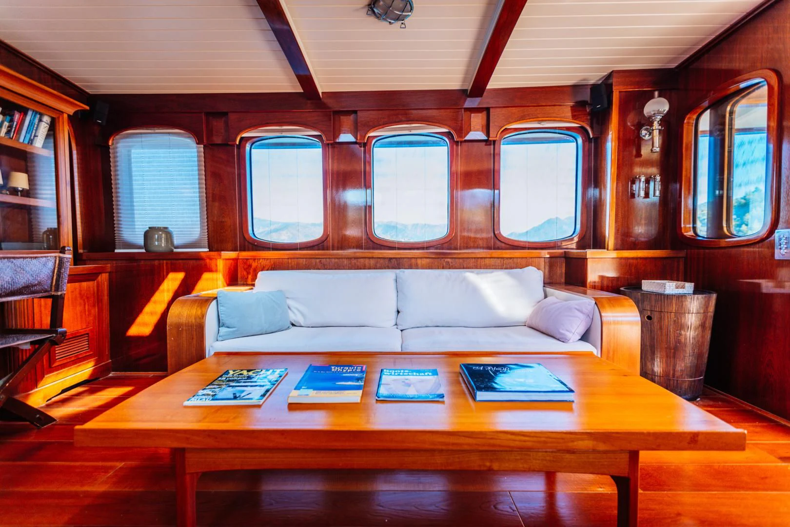 a living room with a couch and a table aboard LARIMAR Yacht for Sale