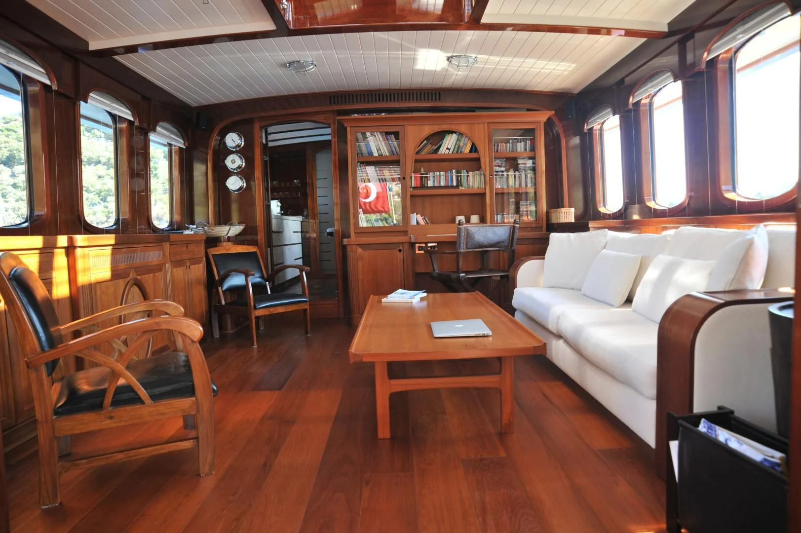 a living room with a couch and a coffee table aboard LARIMAR Yacht for Sale