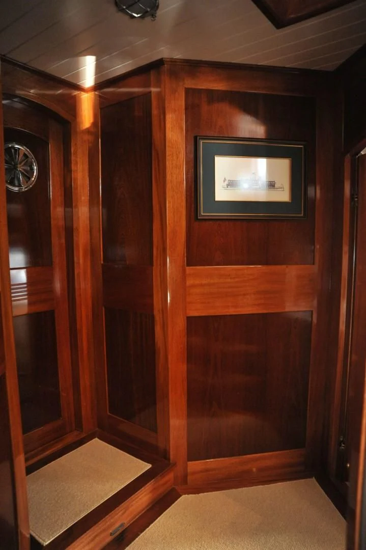 a wooden closet with a picture on it aboard LARIMAR Yacht for Sale