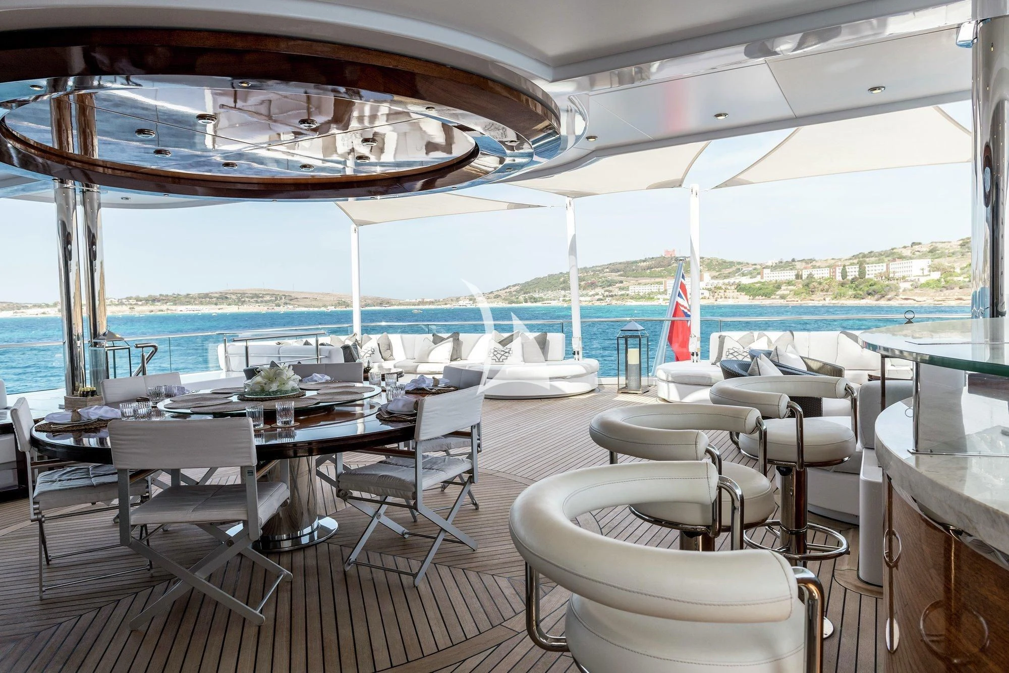 a room with tables and chairs aboard TALISMAN C Yacht for Charter